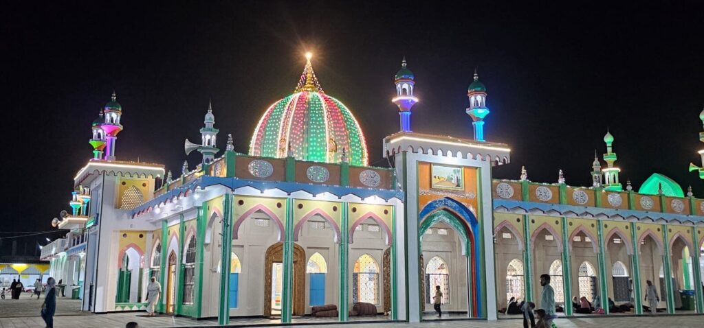 The dome lit in green and pink