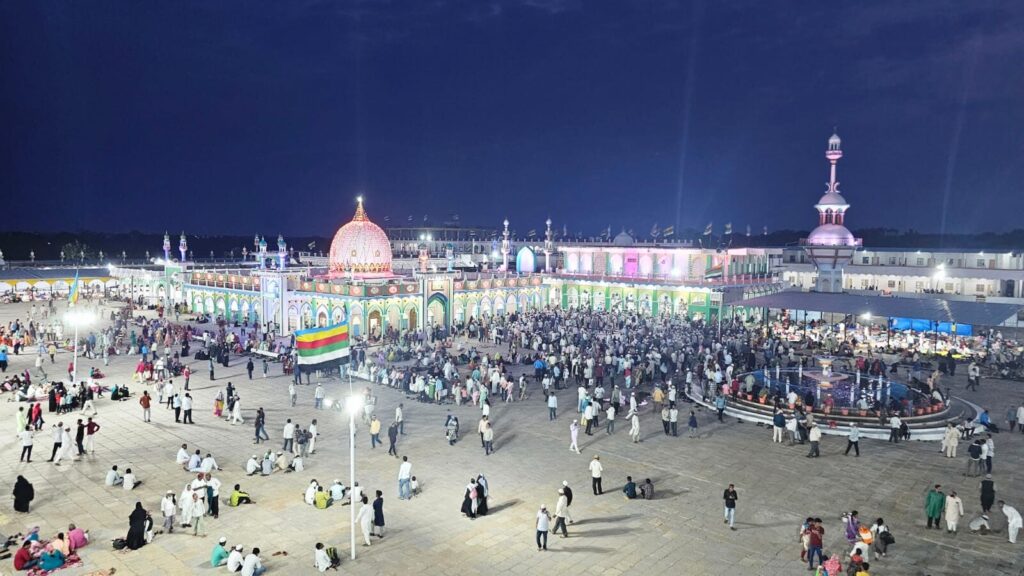 Devotees gathered in the courtyard at night